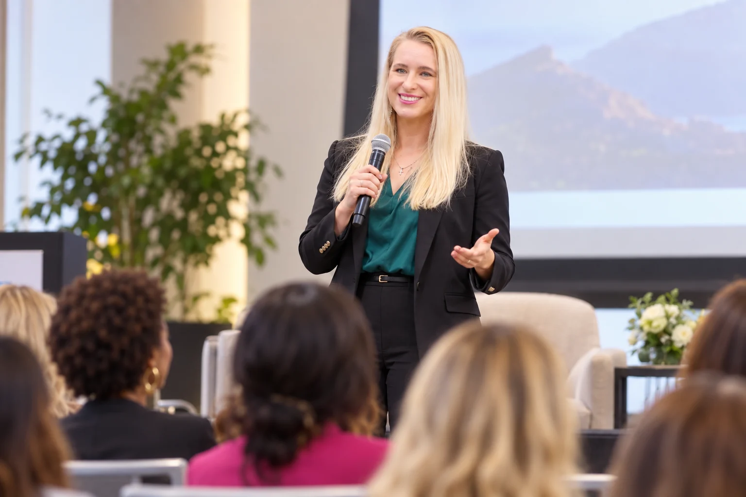 Cami J. Hostetler speaking to an audience of women at a conference